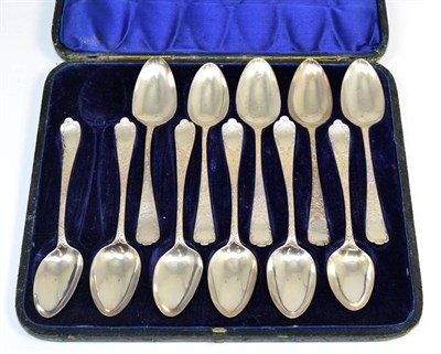 Lot 379 - A matched set of eleven George III/William IV silver dessert spoons, 9 William Eaton London 1837, 2