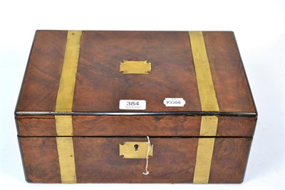 Lot 384 - ~ A brass mounted walnut writing box