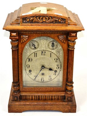 Lot 388 - An oak chiming table clock, circa 1910