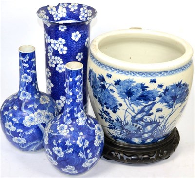 Lot 396 - A Chinese blue and white planter (a.f.), together with three prunus vases