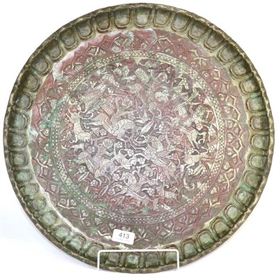 Lot 413 - A Persian copper tray, worked with hunt scene within shaped border (a.f.)