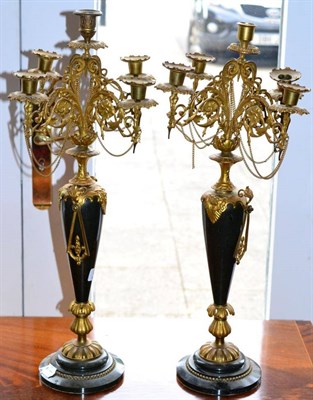 Lot 425 - ~ A pair of French marble and gilt metal candelabras