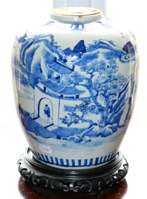 Lot 426 - A Chinese porcelain blue and white jar decorated with figures and buildings in a mountainous...