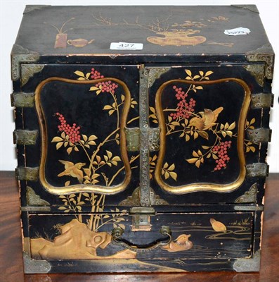 Lot 427 - A Japanese lacquered cabinet