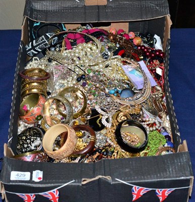 Lot 429 - A large quantity of costume jewellery, including bangles, bracelets and various necklaces, contents