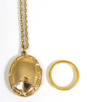 Lot 438 - A 22 carat gold band ring and a locket on chain (2)