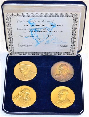 Lot 442 - A cased set of four John Pinches "The Churchill Medals", 24ct gold on Sterling silver, set...