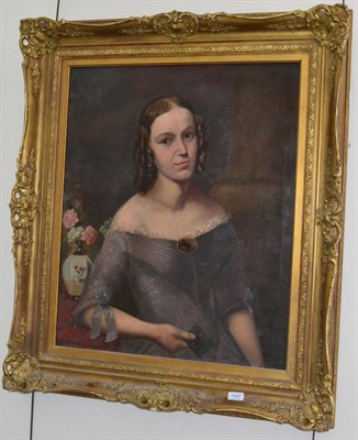 Lot 1047 - Follower of Margaret Carpenter (1793-1872) Portrait of a young lady, half length, wearing her...