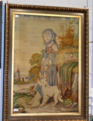 Lot 1069 - A Victorian woolwork picture of a standing young girl with puppy, in a decorative gilt frame