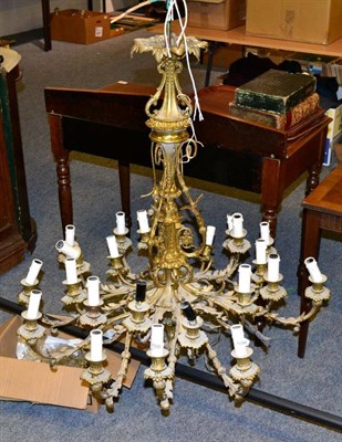 Lot 1100 - ~ A gilt metal scroll and leaf cast twenty three light candelabra (in need of refurbishment)