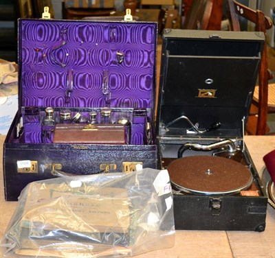 Lot 1108 - Three various dressing cases and an HMV portable gramophone with records