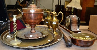 Lot 1109 - A group of brass and copper including large chargers, a pair of ewers, copper urn, bed pan,...