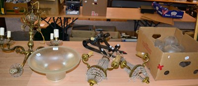 Lot 1163 - ~ A six-light gilt metal chandelier, two pairs of wall sconces and a group of oil lamp shades