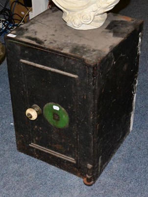 Lot 1191 - A small cast iron safe (keys lacking, but open)