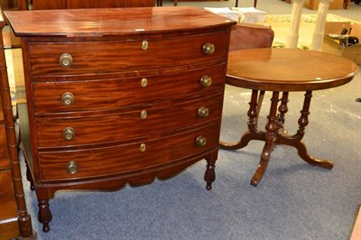 Lot 1200 - ~ Mahogany bow front four height chest of drawers; and a mahogany oval occasional table (2)