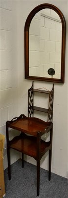 Lot 1216 - ~ A George III style tray-top two-tier mahogany table; a hanging shelf; and arched mirror