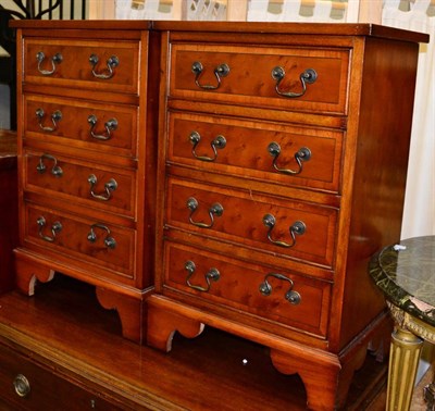 Lot 1225 - Pair of reproduction yew wood bedside chests of drawers