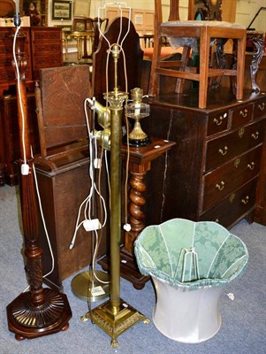 Lot 1232 - A brass Corinthian columnar standard lamp; mahogany standard lamp; an uplighter; and a...