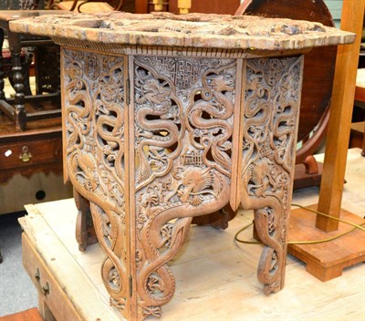 Lot 1235 - Chinese carved wooden folding occasional table decorated with dragons