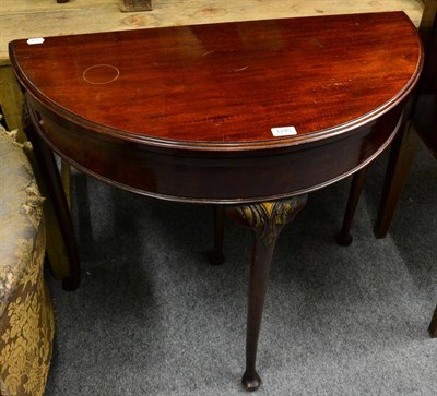 Lot 1245 - A mahogany D-shaped fold over card table