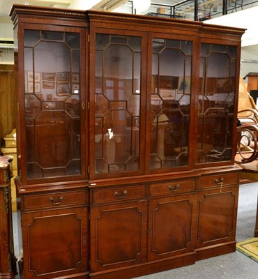 Lot 1261 - ~ A modern mahogany breakfront bookcase in the 18th century style