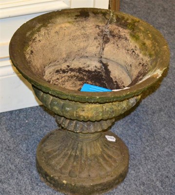 Lot 1263 - Pair of 19th century weathered sandstone urns with gadrooned bodies