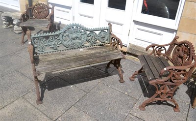 Lot 1265 - Cast iron garden bench decorated with hounds and game, with slatted wooden seat; together with...