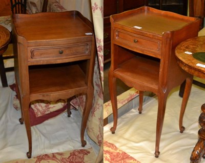 Lot 1277 - A pair of French style bedside cabinets, with three-quarter gallery backs above a single frieze...