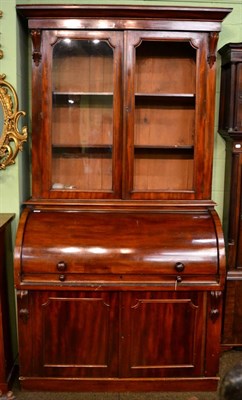 Lot 1284 - ~ A Victorian mahogany cylinder bureau bookcase (glaze section to one door missing)