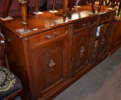 Lot 1309 - ~ A late 19th century French walnut three door sideboard