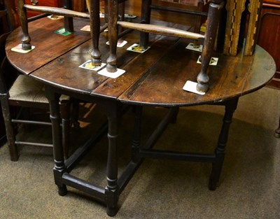 Lot 1311 - An 18th/early 19th century oak gateleg dining table