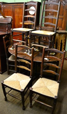 Lot 1312 - Set of six rush-seated ladder back country chairs