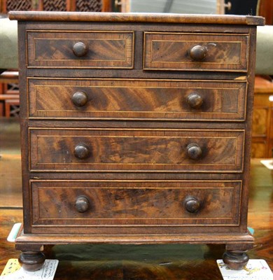 Lot 1320 - A 19th century mahogany miniature four height chest of drawers