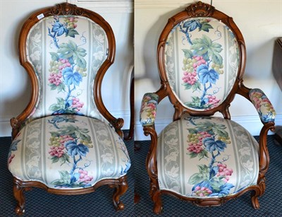 Lot 1361 - ~ A pair of Victorian walnut spoon back chairs