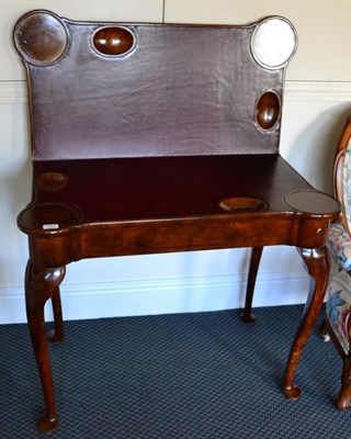 Lot 1362 - ~ Georgian stye walnut fold-over card table on cabriole legs, with hinged leaf enclosing gaming...