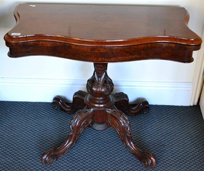 Lot 1364 - ~ A Victorian walnut serpentine front card table