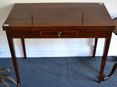 Lot 1372 - ~ A George III mahogany fold-over rectangular tea table