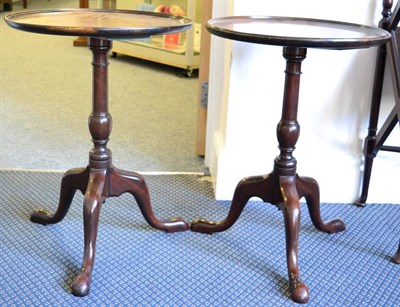 Lot 1373 - ~ A near pair of 20th century Georgian style mahogany tripod tables