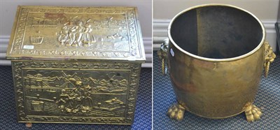 Lot 1375 - ~ A brass embossed coal box and a brass jardiniere on claw feet (2)