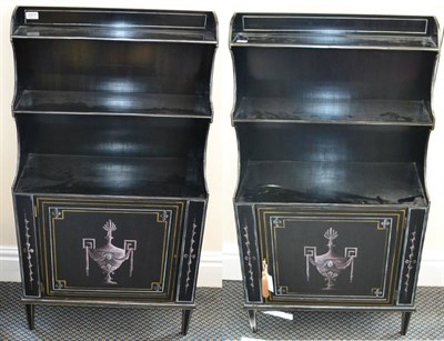 Lot 1377 - A pair of black painted Regency style waterfall bookcase cabinets