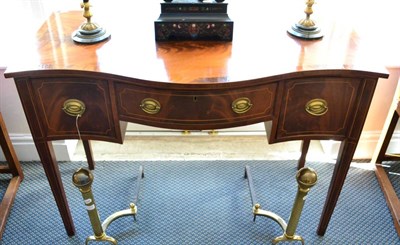 Lot 1378 - ~ A George III style serpentine fronted mahogany sideboard, the drawer stamped J R Hibbard