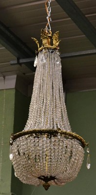 Lot 1388 - A gilt metal beaded chandelier