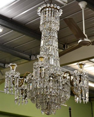 Lot 1389 - Five branch gilt metal chandelier with glass prism drop lustres