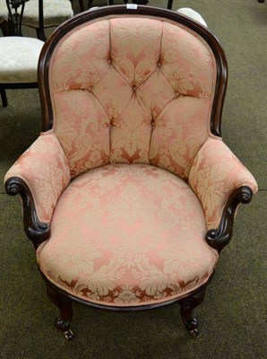 Lot 1393 - ~ A Victorian mahogany upholstered spoon back armchair