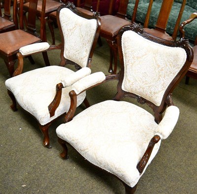 Lot 1397 - Pair of carved mahogany framed part upholstered open armchairs