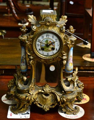 Lot 1408 - A French gilt metal and porcelain striking mantel clock