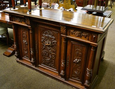 Lot 1411 - ~ A 19th century and later French carved walnut three door side cabinet