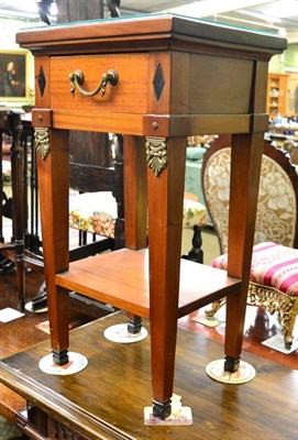 Lot 1412 - A reproduction hardwood and gilt metal mounted side table in Empire style, of recent date, with...