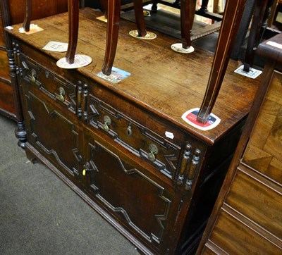 Lot 1420 - A 1920's carved oak sideboard of small proportions