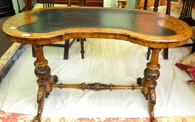 Lot 1436 - ~ A Victorian walnut and marquetry inlaid kidney shaped writing table